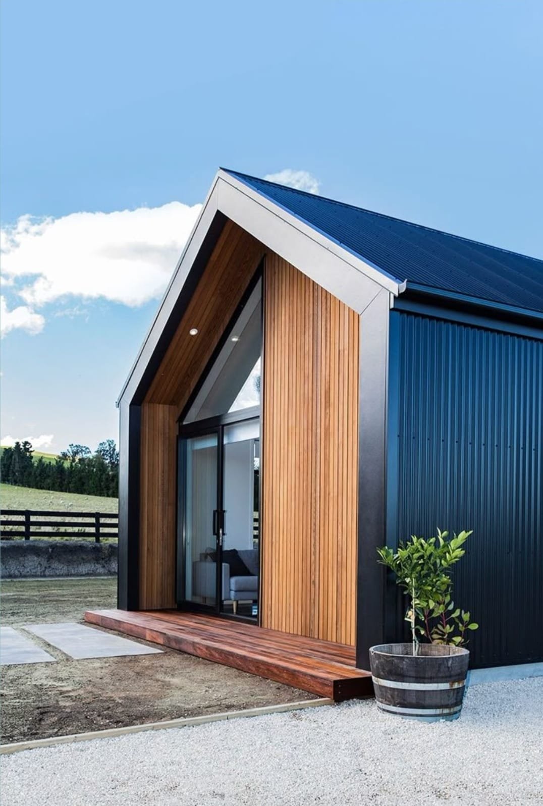 ART COLOR modular A-frame home in a mountain landscape